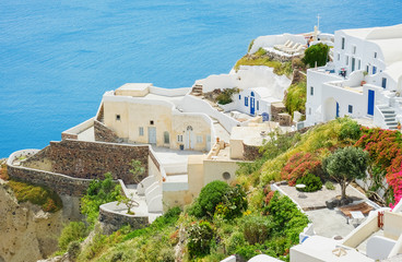 White town on the blossoming steep coast of the island
