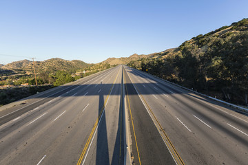 Closed empty ten lane freeway in the San Fernando Valley area of Los Angeles, California.