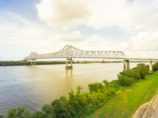 Aerial view of iron cantilever bridge over the Mississippi river in rural Louisiana, America with...