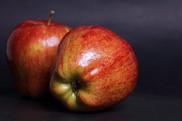 Red apples on black background. Healthy eating concept.