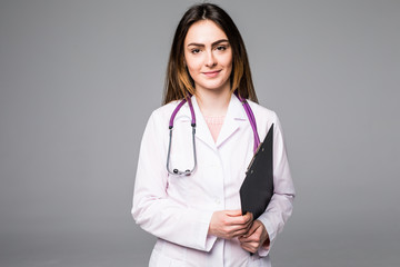 woman doctor or nurse with clipboard with blank paper isolated on grey background - obrazy, fototapety, plakaty