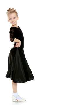 Beautiful little dancer in a black dress.