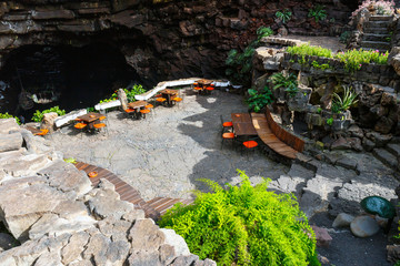 Tables and chairs in volcanic cave in Jameos del Agua, Lanzarote, Canary Islands, Spain