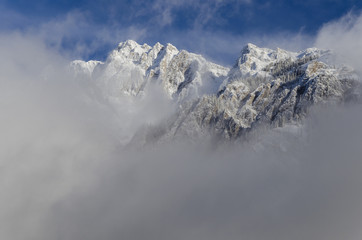 Mountain peaks emerging from the fog. Banff National Park, Alberta, Canada