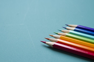 color pencils on a green background