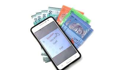 smart phone and malaysia cash. Online shopping consept. on white backgroundonline business consept