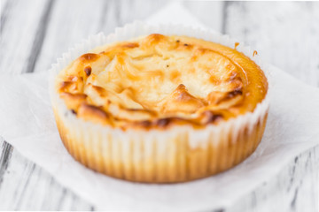 Mini Cheesecake on wooden background (selective focus)