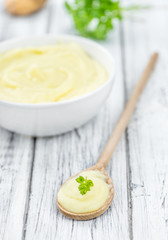 Wooden table with Mashed Potatoes (selective focus)