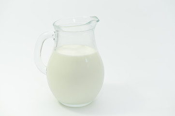 Obraz na płótnie Canvas Fresh cow milk in a jar on a light background.