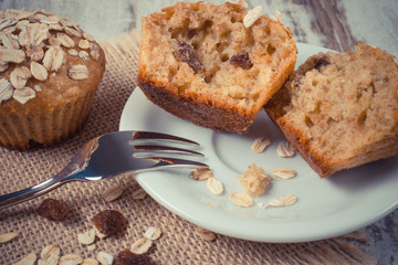 Vintage photo, Muffins with oatmeal baked with wholemeal flour on plate, delicious healthy dessert