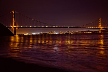 Fototapeta na wymiar San Francisco from Kirby Cove with the city skyline viewable underneath the span of the landmark Golden Gate Bridge