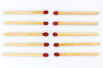 Closeup of Matchsticks are organized on white background.