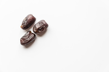 Dates or kurma over white background