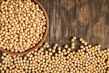 Soybeans on old wood background,top view