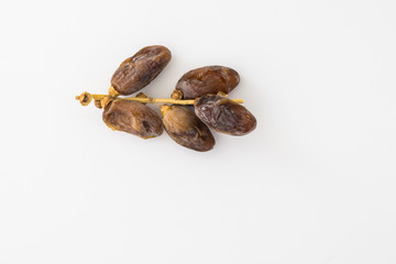 Dates or kurma over white background