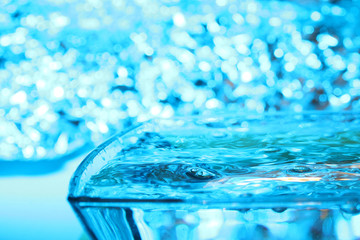 Water background / Water is a transparent and nearly colorless chemical substance that is the main constituent of Earth's streams, lakes, and oceans, and the fluids of most living organisms