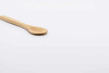 Wooden spoon over white background.