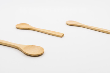Wooden spoon over white background.