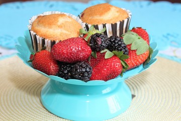 Fresh baked muffins with blueberries and strawberries