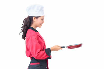 Smiling woman chef holding cooking utensils