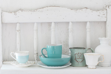  dinnerware on white wooden shelf