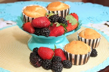 Fresh baked muffins with blueberries and strawberries