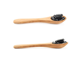 Spoon full of capsule pills isolated