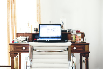 Home office working space in the morning, selective focus