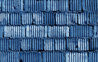 Blue color grungy brick wall pattern.