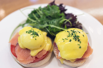delicious eggs benedict with smoked salmon, shallow depth of field - filter effect