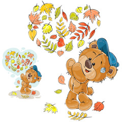Fototapeta premium Vector autumn illustration of a brown teddy bear threw up the fallen leaves and made a heart out of them. Print, template, design element