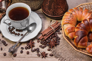     Cup of hot coffee and fresh croissants