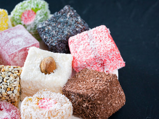 Turkish delight on black rustic background