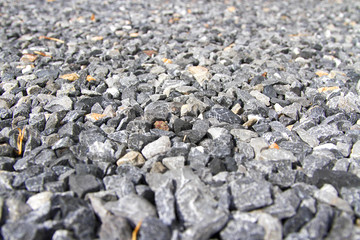 Many granite on the floor during the day.