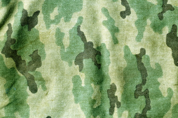 Weathered camouflage uniform pattern.