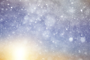 Snowfall texture of snowflakes on blurred background