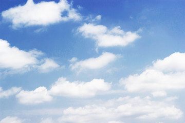 Naklejka na ściany i meble Soft white clouds against blue sky background and empty space for your design