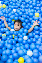 Fototapeta na wymiar girl playing plastic ball