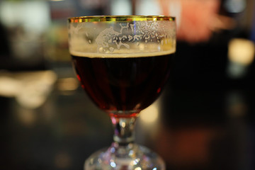 Serving a glass of red wine in a restaurant