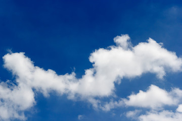 Obraz premium Soft white clouds against blue sky background and empty space for your design