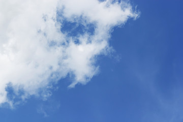 Soft white clouds against blue sky background and empty space for your design