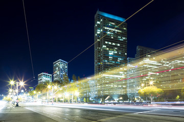 Fototapeta na wymiar traffic on road in modern city at night