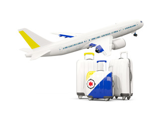 Luggage with flag of bonaire. Three bags with airplane