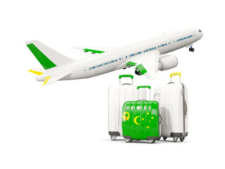 Luggage with flag of cocos islands. Three bags with airplane