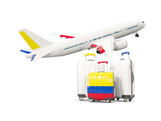 Luggage with flag of colombia. Three bags with airplane
