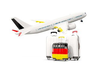 Luggage with flag of germany. Three bags with airplane
