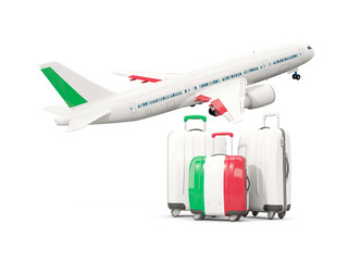 Luggage with flag of italy. Three bags with airplane