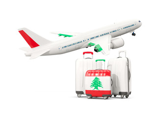 Luggage with flag of lebanon. Three bags with airplane