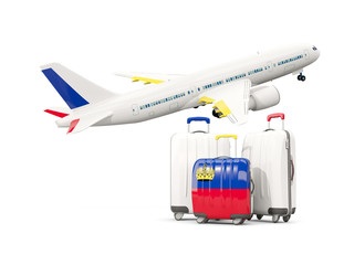 Luggage with flag of liechtenstein. Three bags with airplane