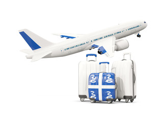 Luggage with flag of martinique. Three bags with airplane